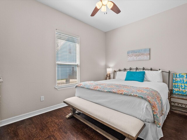 1922 Blue Water Hwy, Surfside Beach, TX 77541 - bedroom with wood finished floors, multiple windows, baseboards, and ceiling fan
