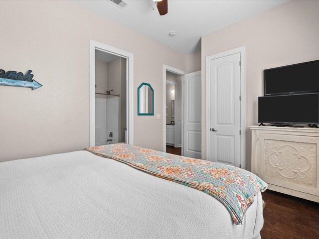 1922 Blue Water Hwy, Surfside Beach, TX 77541 - bedroom with a ceiling fan, dark wood-style flooring, and ensuite bathroom