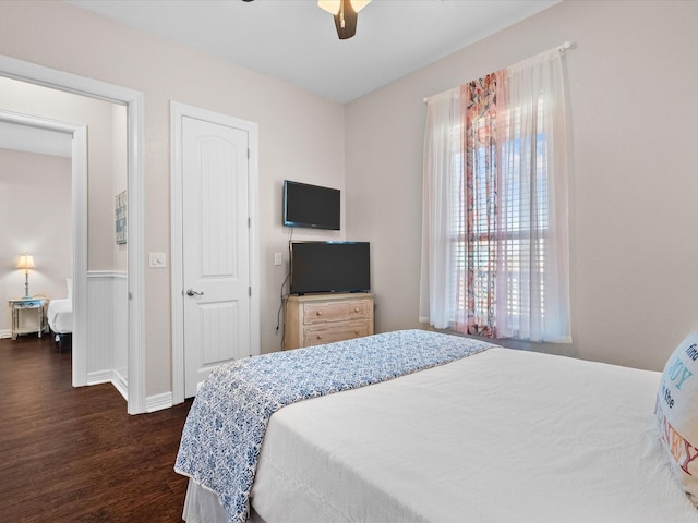 1922 Blue Water Hwy, Surfside Beach, TX 77541 - bedroom featuring dark wood-style flooring, a ceiling fan, and baseboards
