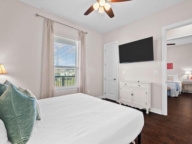 1922 Blue Water Hwy, Surfside Beach, TX 77541 - bedroom with dark wood-style flooring, baseboards, and a ceiling fan
