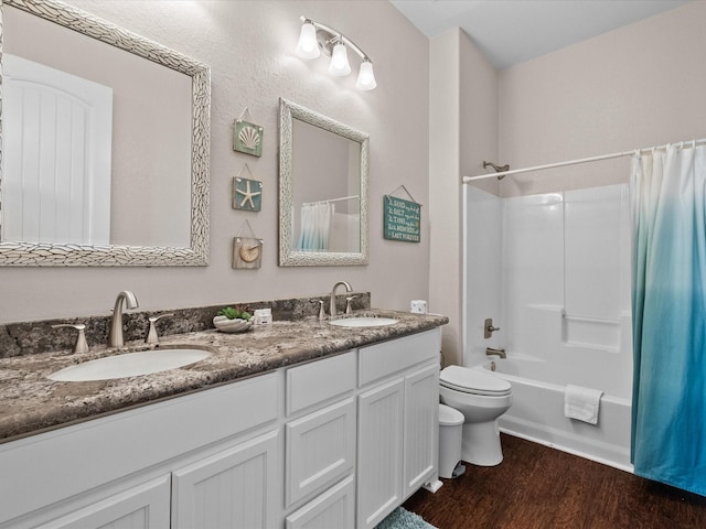 1922 Blue Water Hwy, Surfside Beach, TX 77541 - bathroom with toilet, double vanity, wood finished floors, and shower / bath combination with curtain