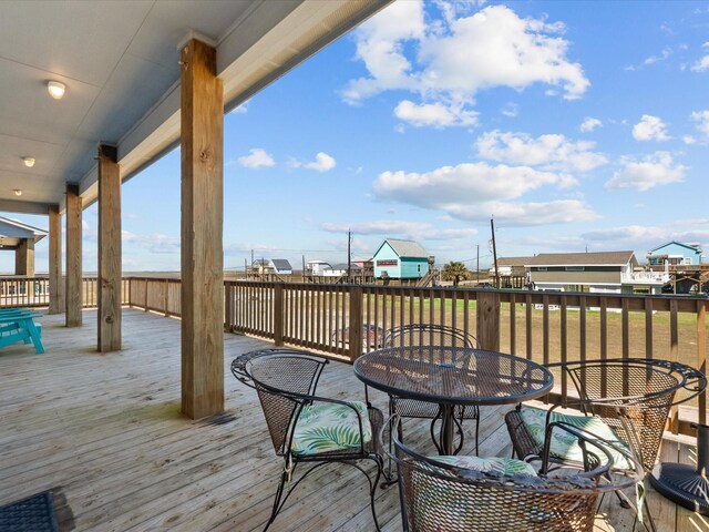 1922 Blue Water Hwy, Surfside Beach, TX 77541 - wooden terrace with outdoor dining area