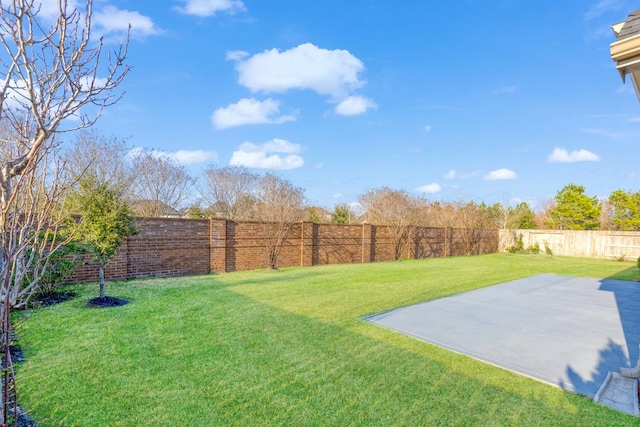 view of yard with a fenced backyard and a patio