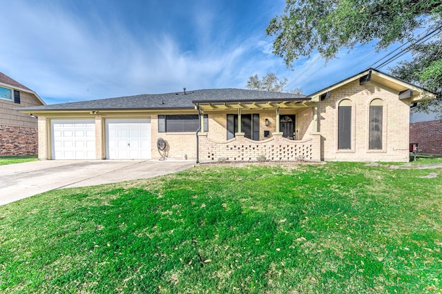 ranch-style house featuring an attached garage, brick siding, concrete driveway, and a front yard