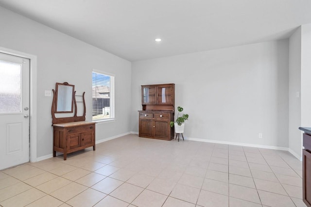 entryway with recessed lighting, baseboards, and light tile patterned floors