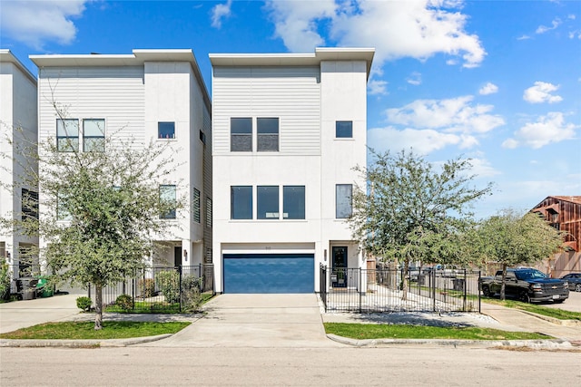 multi unit property featuring driveway, a garage, fence, and stucco siding