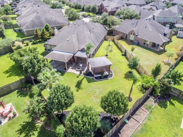 birds eye view of property with a residential view