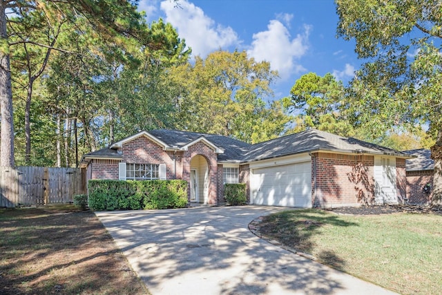 single story home with brick siding, concrete driveway, a front yard, fence, and a garage