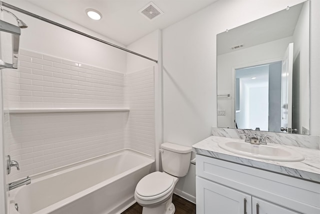 bathroom featuring visible vents, shower / bathing tub combination, vanity, and toilet