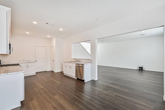 kitchen featuring a sink, visible vents, open floor plan, dishwasher, and dark wood finished floors