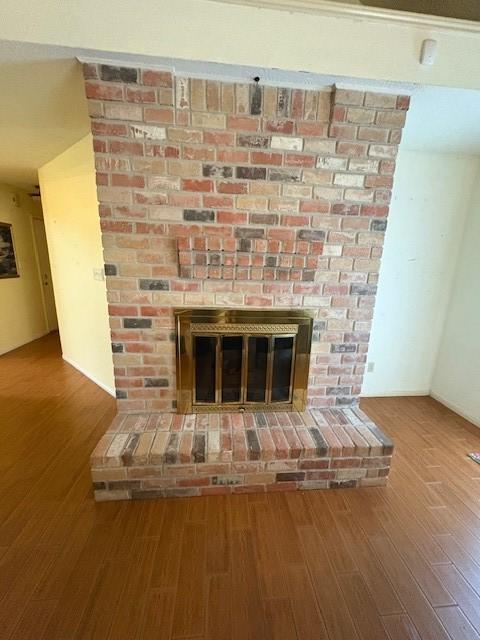 9427 Walnut Glen Dr, Houston, TX 77064 - details with a fireplace and wood finished floors