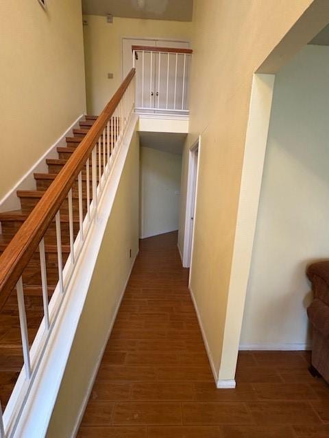 9427 Walnut Glen Dr, Houston, TX 77064 - staircase with a towering ceiling, baseboards, and wood finished floors