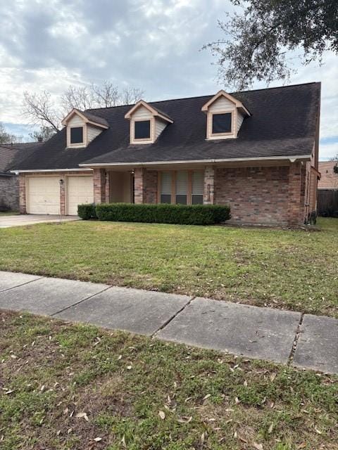 view of front facade with a garage, concrete driveway, brick siding, and a front lawn