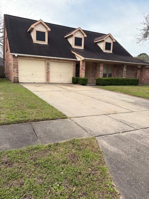 9427 Walnut Glen Dr, Houston, TX 77064 - cape cod-style house with a garage, brick siding, driveway, and a front lawn