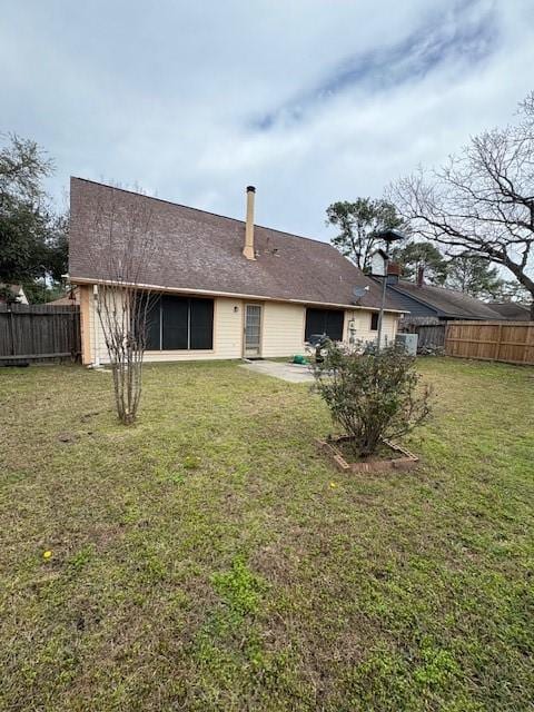 9427 Walnut Glen Dr, Houston, TX 77064 - rear view of property featuring a yard, a patio, and a fenced backyard