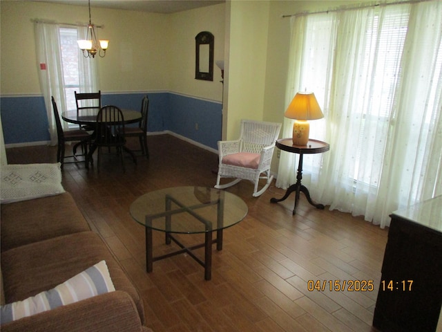 9427 Walnut Glen Dr, Houston, TX 77064 - living area featuring a chandelier, baseboards, and wood finished floors