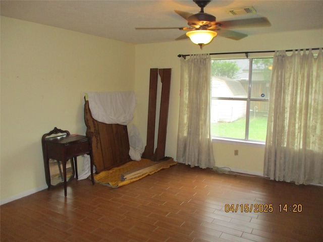 9427 Walnut Glen Dr, Houston, TX 77064 - empty room with visible vents, ceiling fan, wood finished floors, and a healthy amount of sunlight