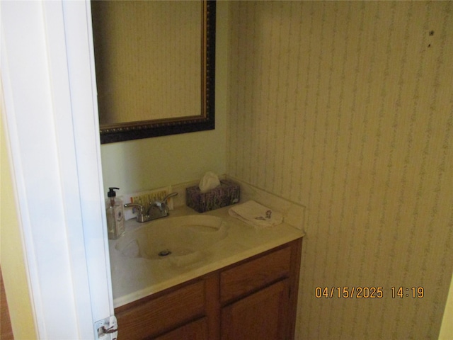 9427 Walnut Glen Dr, Houston, TX 77064 - bathroom featuring wallpapered walls and vanity
