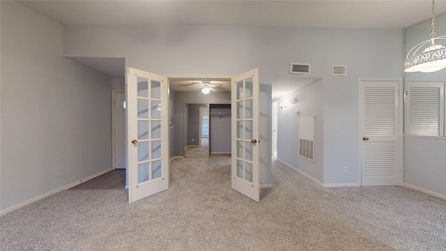 2323 Fairwind Rd Unit 860, Houston, TX 77062 - unfurnished bedroom with french doors, visible vents, baseboards, and carpet flooring