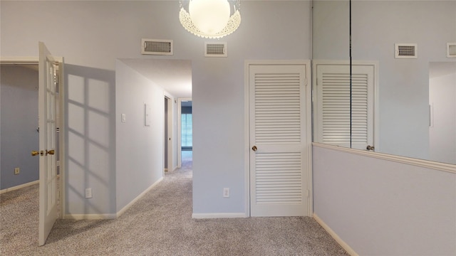 2323 Fairwind Rd Unit 860, Houston, TX 77062 - hallway with carpet floors, baseboards, and visible vents
