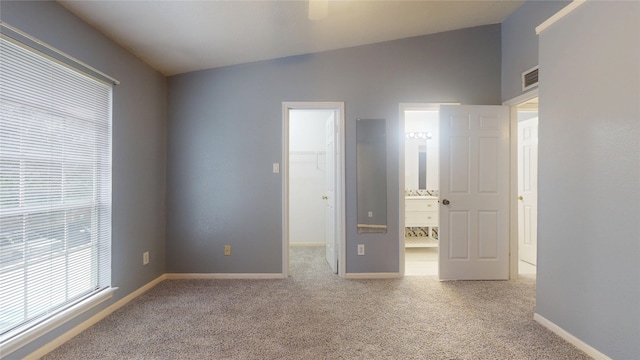 2323 Fairwind Rd Unit 860, Houston, TX 77062 - unfurnished bedroom with a walk in closet, baseboards, visible vents, and carpet