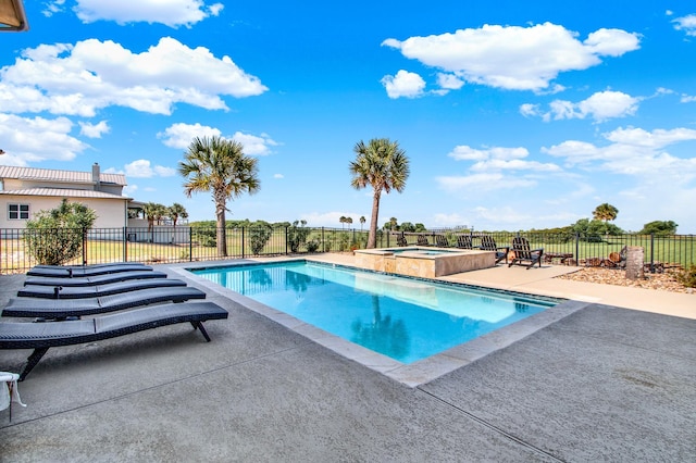 view of pool featuring a fenced in pool, fence, a patio, and an in ground hot tub