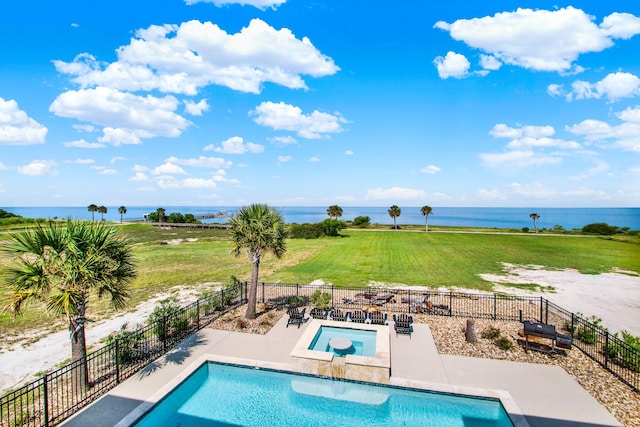 view of swimming pool featuring a water view and fence