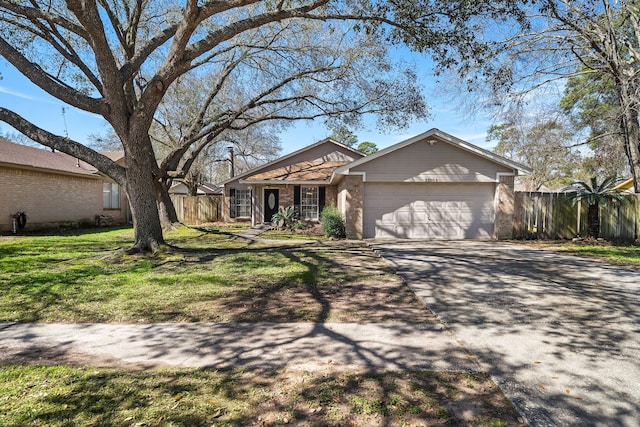 ranch-style home featuring an attached garage, brick siding, fence, driveway, and a front lawn