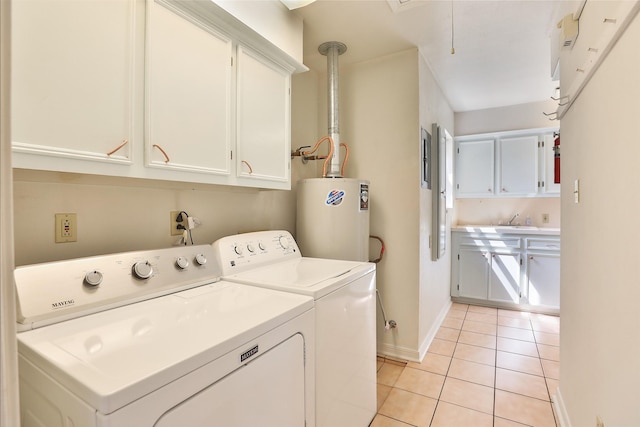 clothes washing area with light tile patterned floors, gas water heater, a sink, cabinet space, and washing machine and clothes dryer