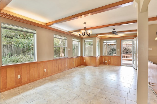 unfurnished sunroom featuring beam ceiling, a wealth of natural light, and ceiling fan with notable chandelier