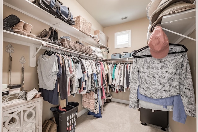 spacious closet with carpet floors and visible vents