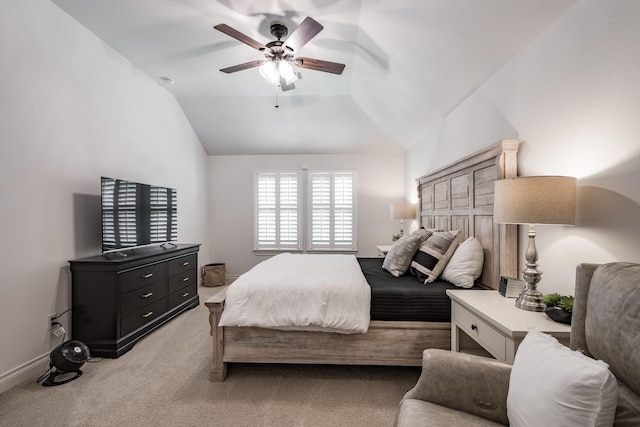 bedroom featuring lofted ceiling, light colored carpet, ceiling fan, and baseboards