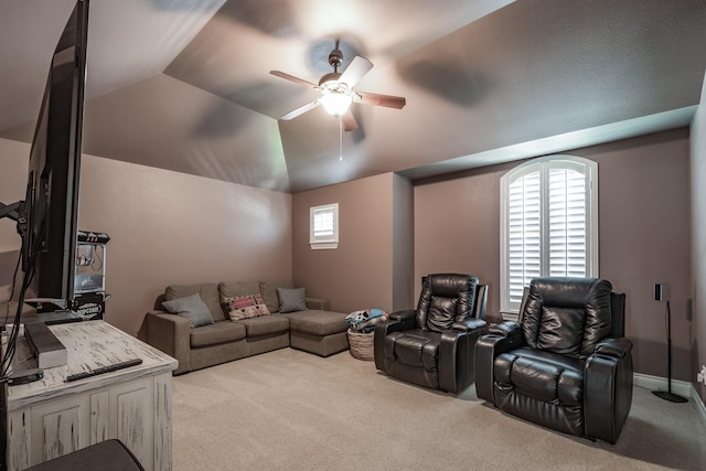 carpeted cinema featuring lofted ceiling, a ceiling fan, and baseboards