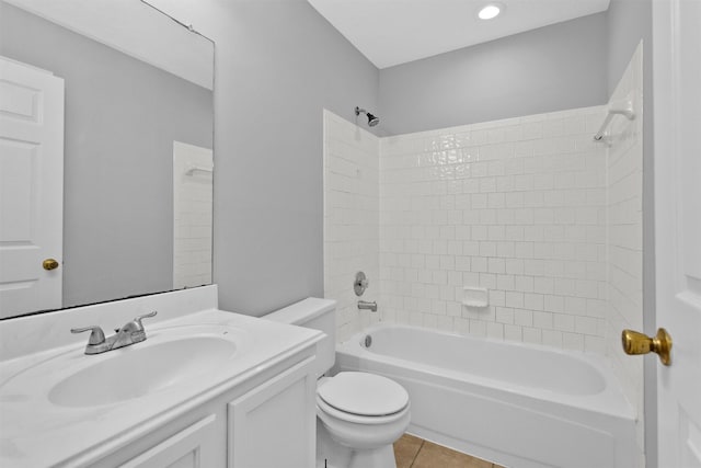 bathroom featuring toilet, bathing tub / shower combination, vanity, and tile patterned floors