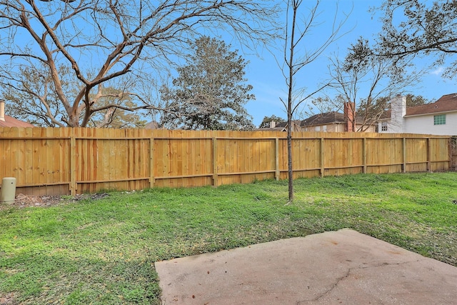 view of yard with a patio and fence