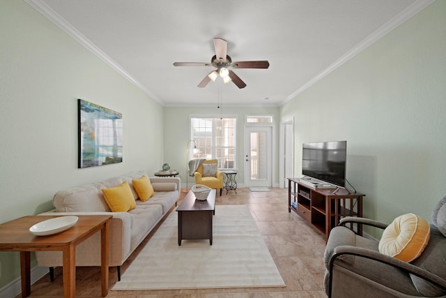 living room with a ceiling fan and crown molding