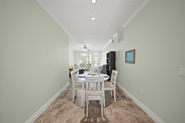 dining room with baseboards, visible vents, and ornamental molding