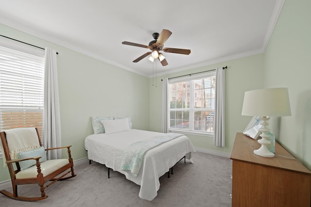 bedroom with light carpet, a ceiling fan, baseboards, and crown molding