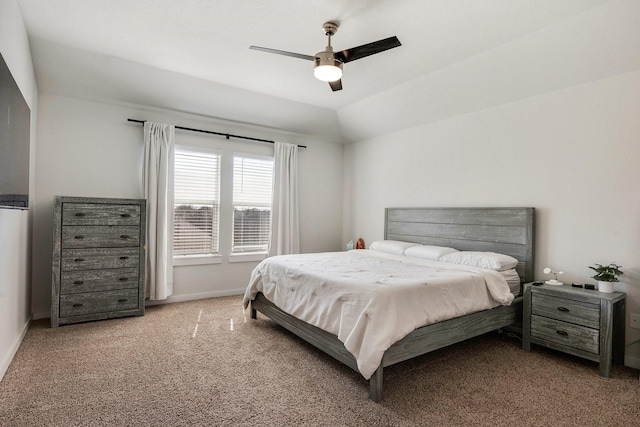 bedroom featuring carpet floors, baseboards, vaulted ceiling, and a ceiling fan