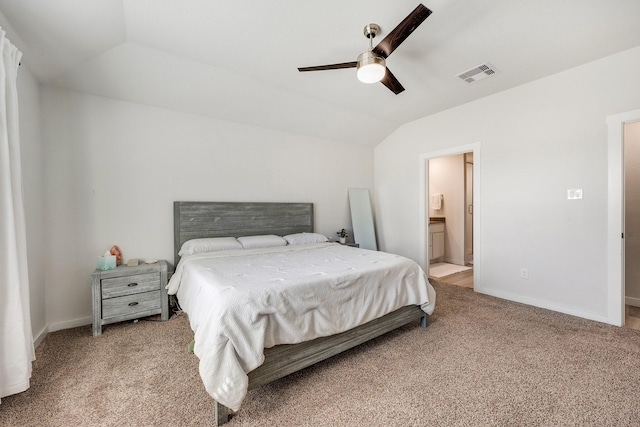 bedroom with lofted ceiling, baseboards, visible vents, and light colored carpet