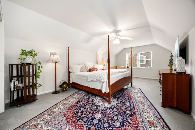 bedroom with lofted ceiling, baseboards, carpet floors, and a ceiling fan