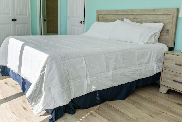 bedroom featuring wood finished floors