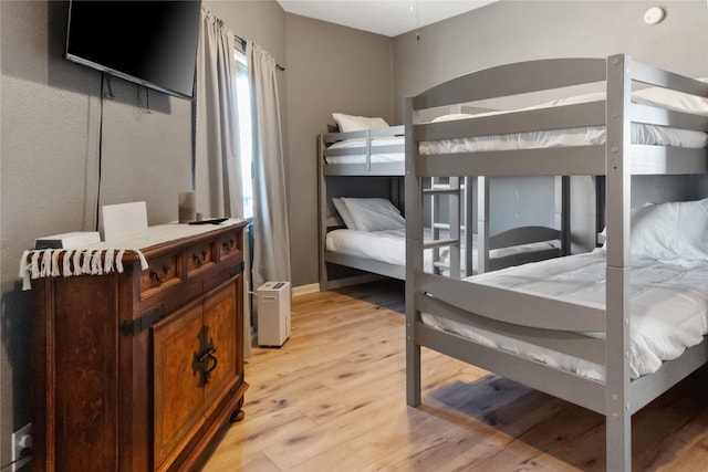 bedroom featuring light wood-style floors