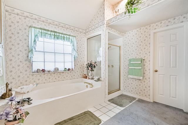 full bathroom featuring lofted ceiling, wallpapered walls, a stall shower, a bath, and tile patterned floors