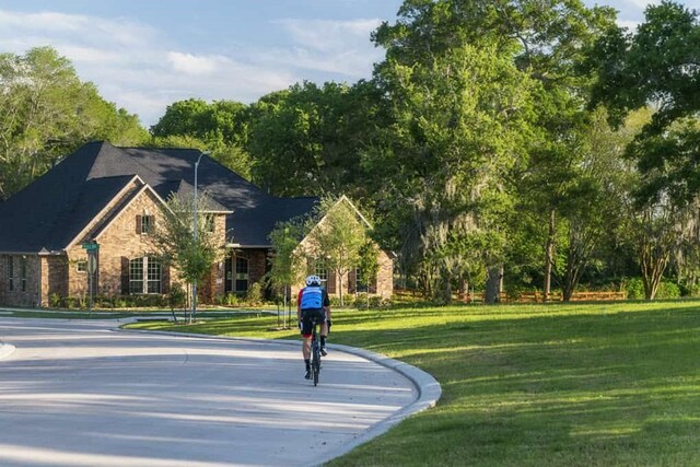 8533 Bois Darc Ln, Richmond, TX 77406 - view of community with a lawn