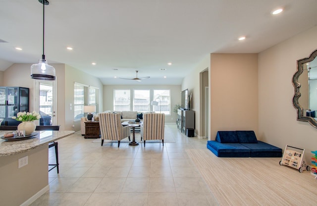 living room featuring light tile patterned floors, ceiling fan, visible vents, and recessed lighting