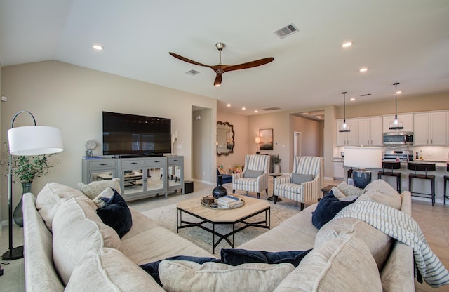 living room with visible vents, vaulted ceiling, a ceiling fan, and recessed lighting