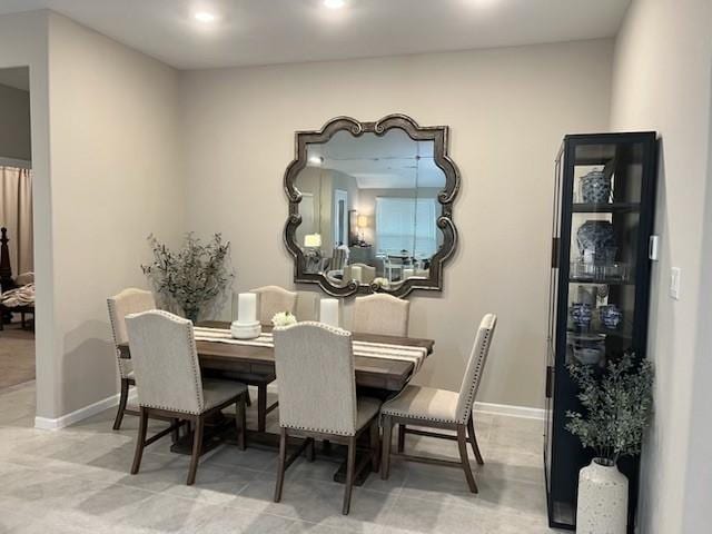 dining room with baseboards