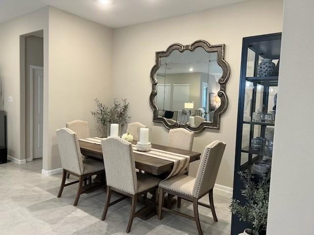 dining room featuring baseboards