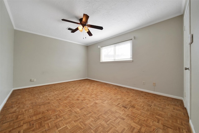 spare room with a textured ceiling, crown molding, visible vents, and baseboards